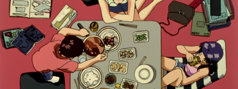 Shinji e Misato si rilassano mangiando assieme